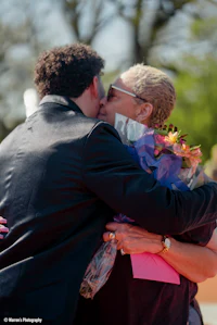 a man is hugging a woman
