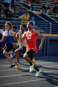 a group of people running on a track
